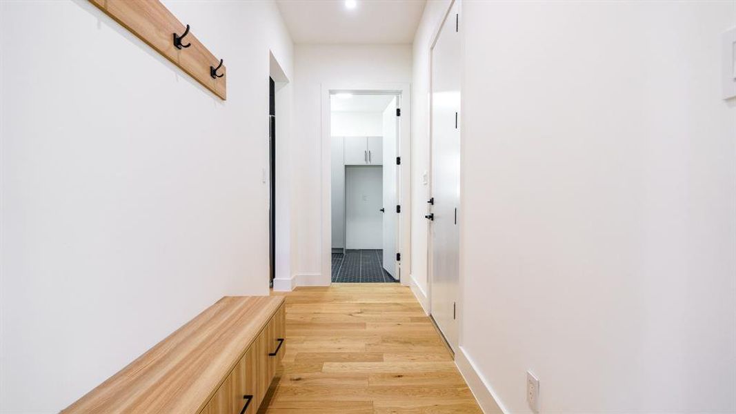 Hall featuring light wood-type flooring