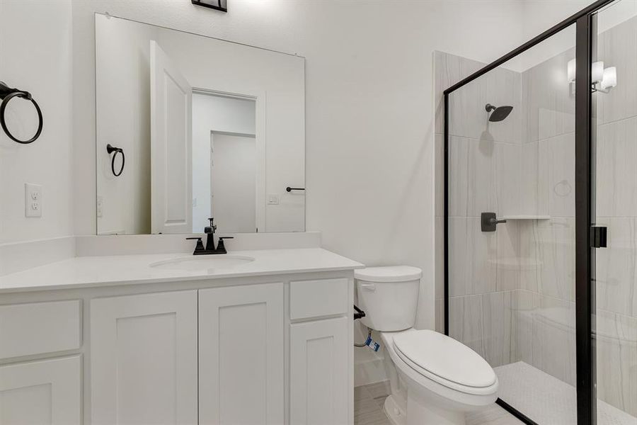 Full bathroom with vanity and a stall shower Full bathroom with vanity and a stall shower