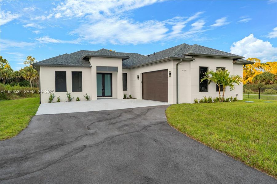 Front exterior of a new home in , Naples, FL, highlighting curb appeal (Image 26). Front exterior of a new home in , Naples, FL, highlighting curb appeal (Image 26).