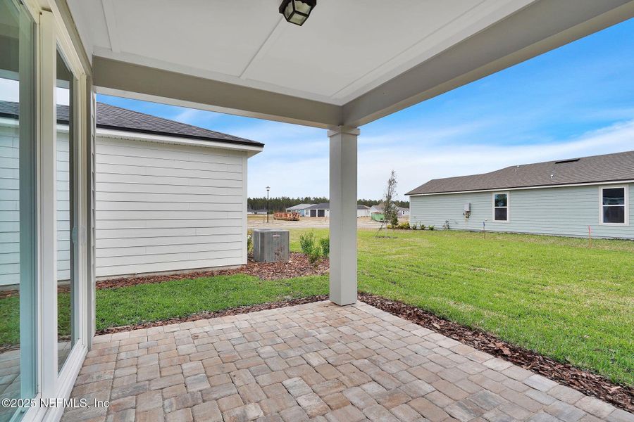Exterior details and patio area of a home in Del Webb Wildlight, Yulee (Image 3).