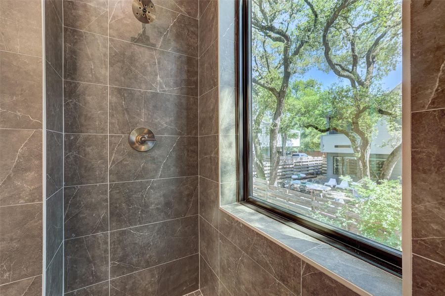 Full bathroom featuring tiled shower