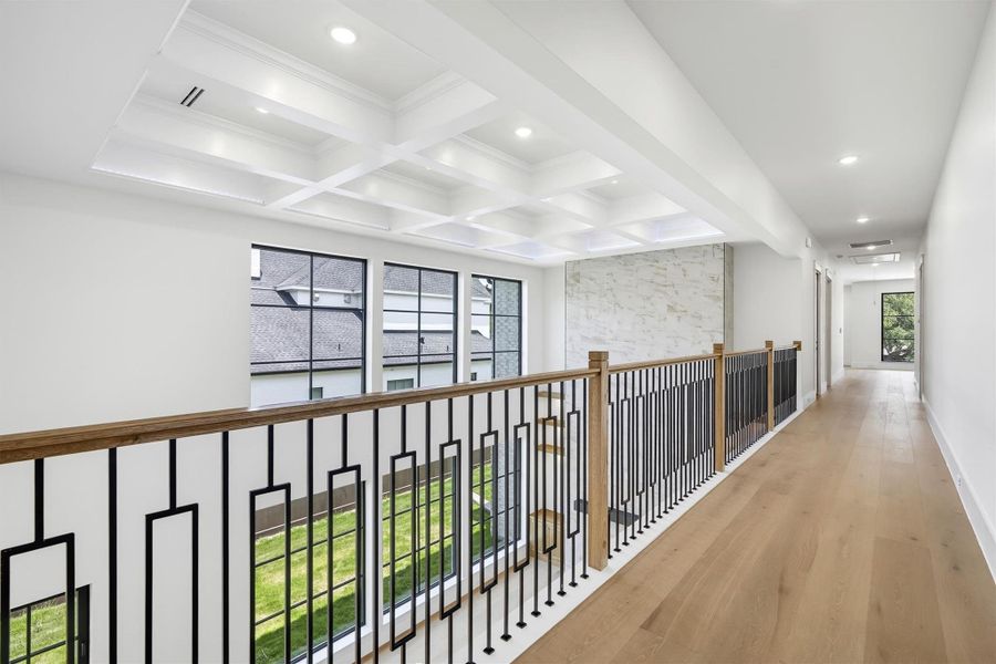This hallway is open to below and allows you to absorb plenty of natural light