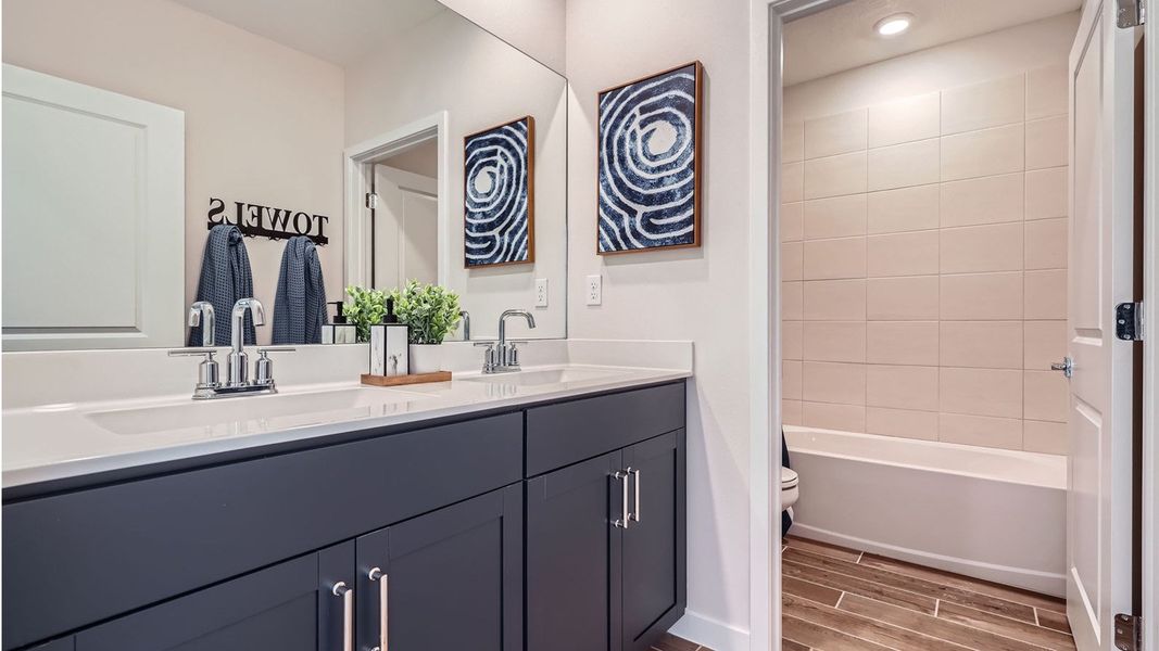 Representative furnished interior of a home built from the Grandcourt by D.R. Horton in Parker Pointe, Homestead (Image 28).