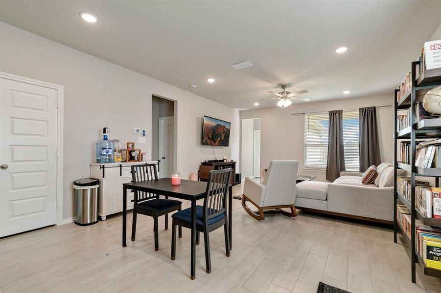 Dining space featuring light wood-type flooring and ceiling fan