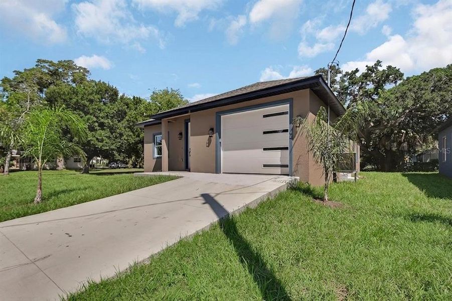 Front exterior of a new home in , Daytona Beach, FL, highlighting curb appeal (Image 17).