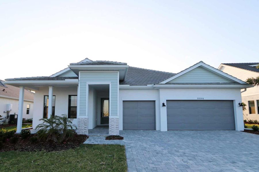 Representative exterior photo of a completed home built from the The Rubytail by David Weekley Homes in Palmera Wellen Park - Classic Series, Venice, FL (Image 2). Representative exterior photo of a completed home built from the The Rubytail by David Weekley Homes in Palmera Wellen Park - Classic Series, Venice, FL (Image 2).