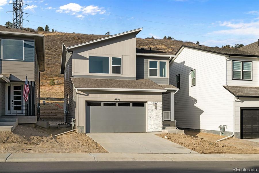 Front exterior of a new home in , Morrison, CO, highlighting curb appeal (Image 1).