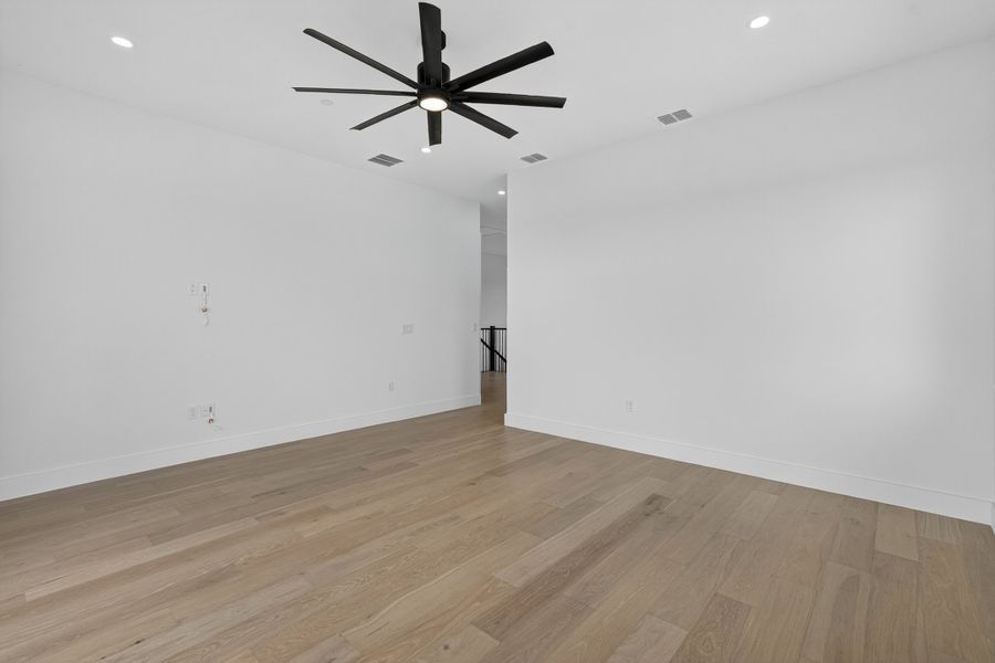 Spacious, unfurnished interior of a new home in Milky Way at River Place, Austin (Image 27).