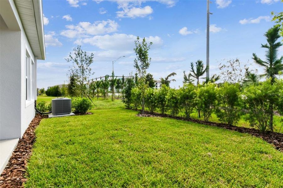 Exterior details and patio area of a home in Chapel Crossings - Garden Series, Wesley Chapel (Image 20).