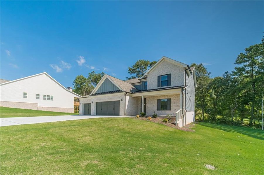 Front exterior of a new home in , Loganville, GA, highlighting curb appeal (Image 28).