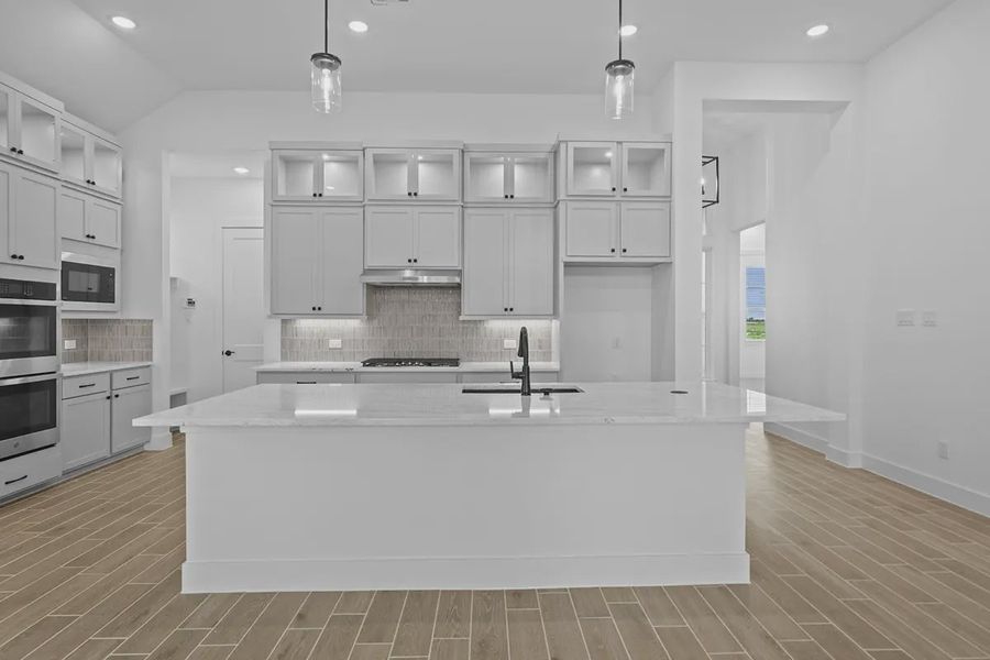 Representative furnished interior of a home built from the Summerton by Chesmar Homes in University Heights, Round Rock (Image 6).