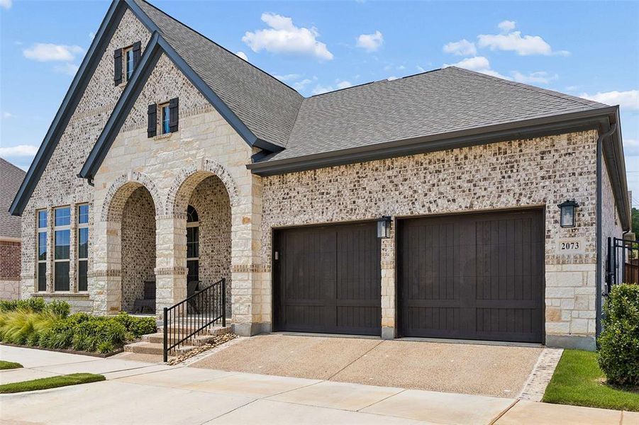 Front exterior of a new home in Elements at Viridian - Garden Series, Arlington, TX, highlighting curb appeal (Image 23).