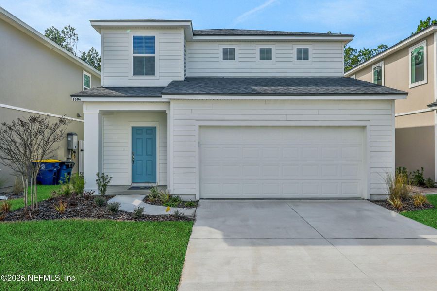 Front exterior of a new home in Cedar Creek, Jacksonville, FL, highlighting curb appeal (Image 26).