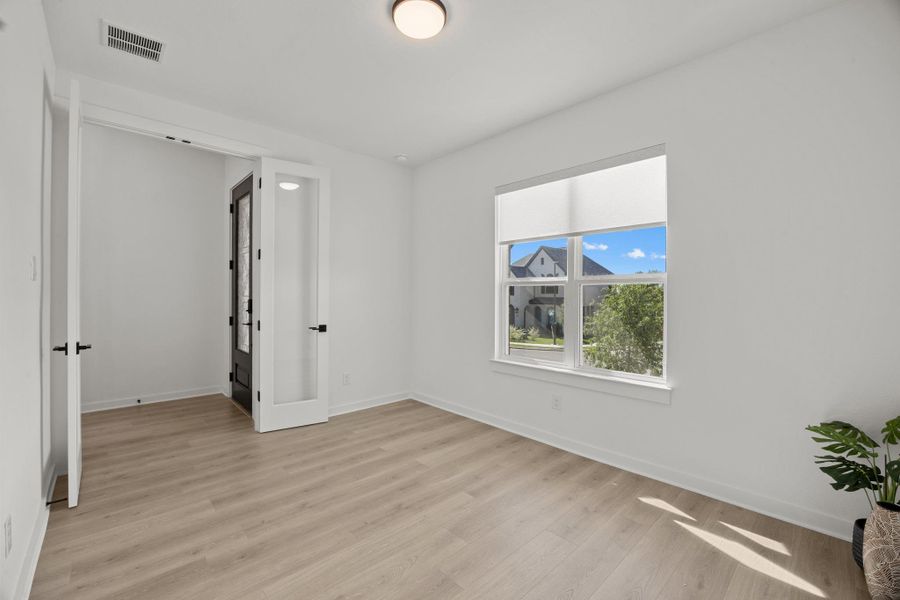 Unfurnished room featuring baseboards and light wood-style flooring