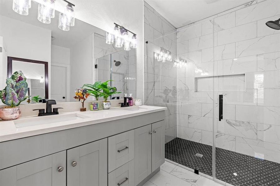 Bathroom featuring vanity and walk in shower