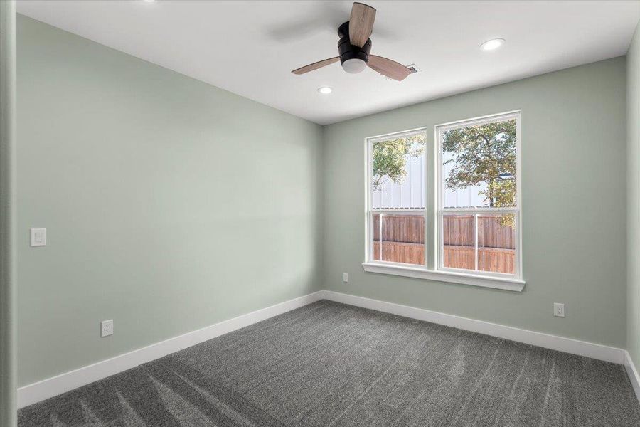 Bedroom number 3  featuring dark carpet, recessed lighting, and a ceiling fan