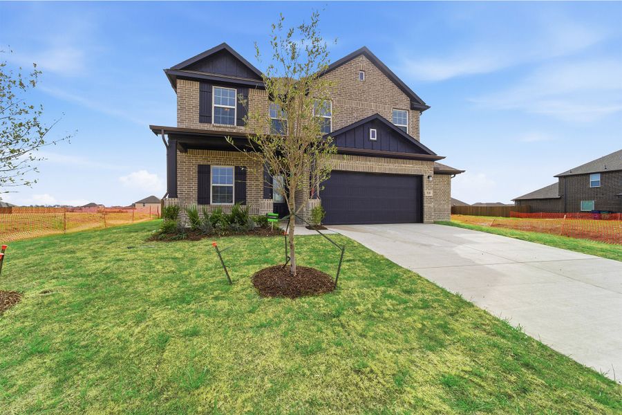 Front exterior of a new home in Saddlebrook Estates, Waxahachie, TX, highlighting curb appeal (Image 2). Front exterior of a new home in Saddlebrook Estates, Waxahachie, TX, highlighting curb appeal (Image 2).