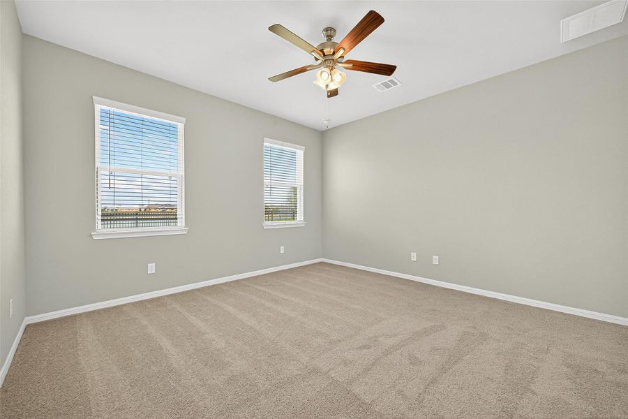 Spacious, unfurnished interior of a new home in Sunterra, Katy (Image 21).