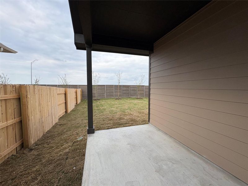 Exterior details and patio area of a home in Willow Springs, Buda (Image 17).