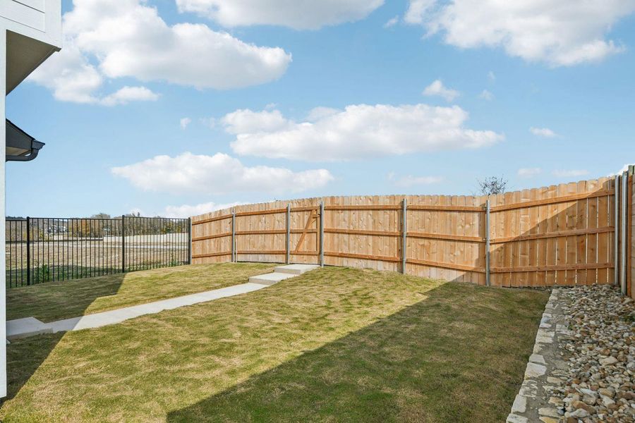 View of fenced backyard