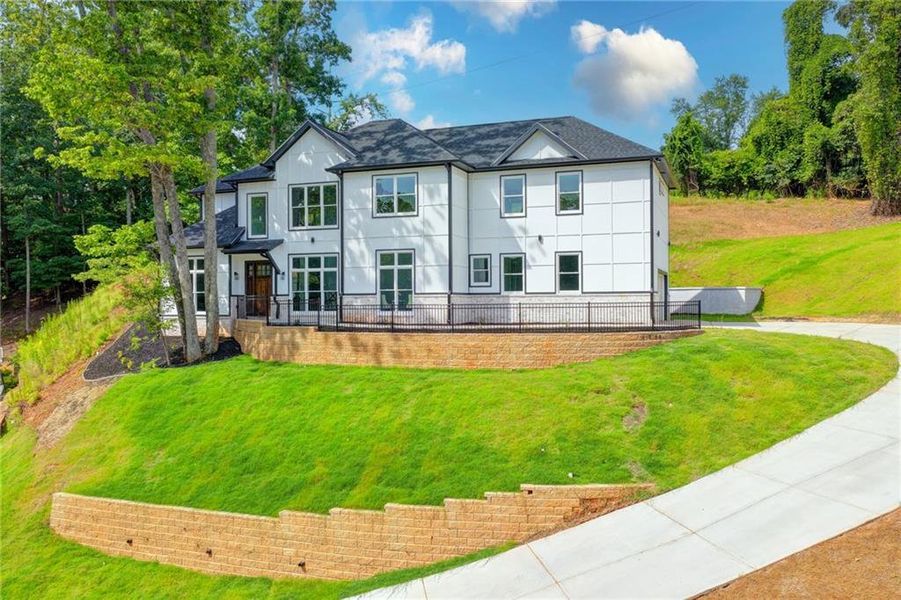 Front exterior of a new home in , Gainesville, GA, highlighting curb appeal (Image 1). Front exterior of a new home in , Gainesville, GA, highlighting curb appeal (Image 1).