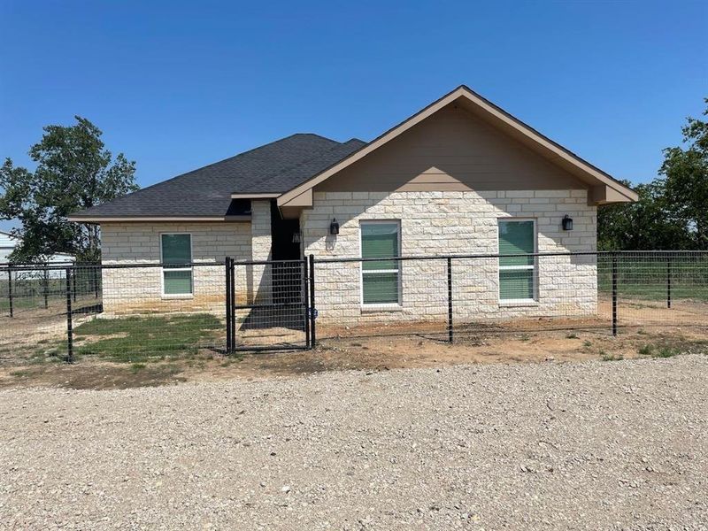 Front exterior of a new home in , Justin, TX, highlighting curb appeal (Image 19).