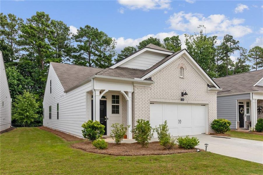 Front exterior of a new home in Rosewood Farms, Acworth, GA, highlighting curb appeal (Image 2). Front exterior of a new home in Rosewood Farms, Acworth, GA, highlighting curb appeal (Image 2).
