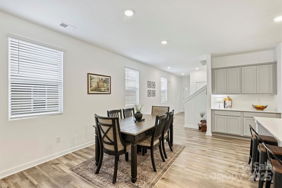 The dining area is spacious enough for a large table.
