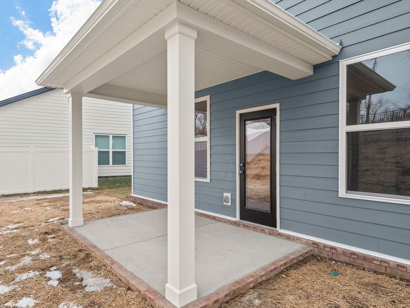 Exterior details and patio area of a home in Woods Crossing, Gallatin (Image 24).