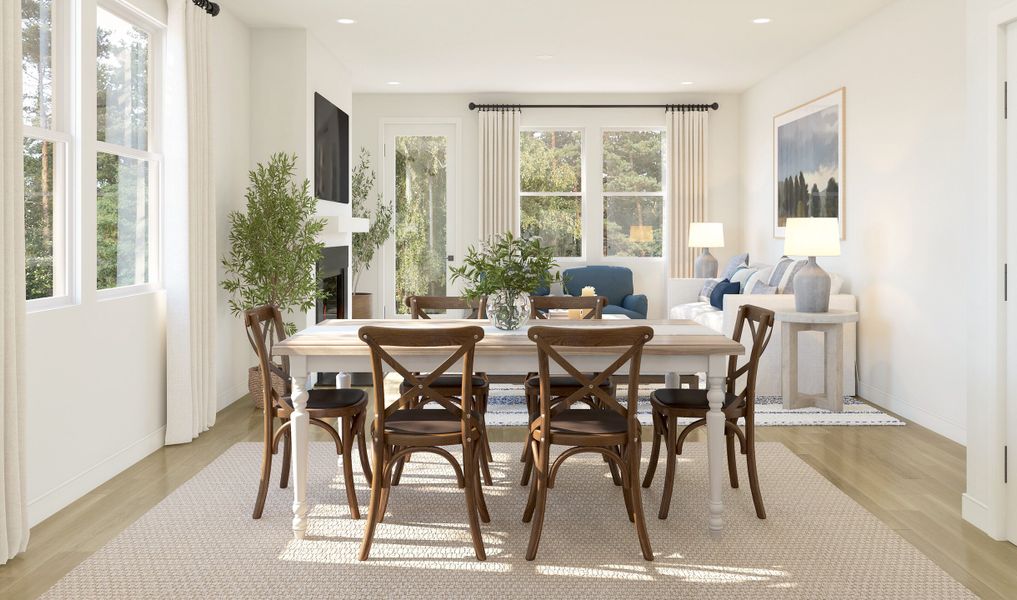 Cozy dining area with gorgeous wood flooring throughout