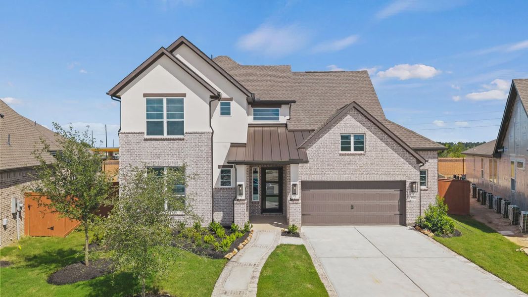Representative exterior photo of a completed home built from the Rivers by Chesmar Homes in Sofi Lakes, Katy, TX (Image 24).