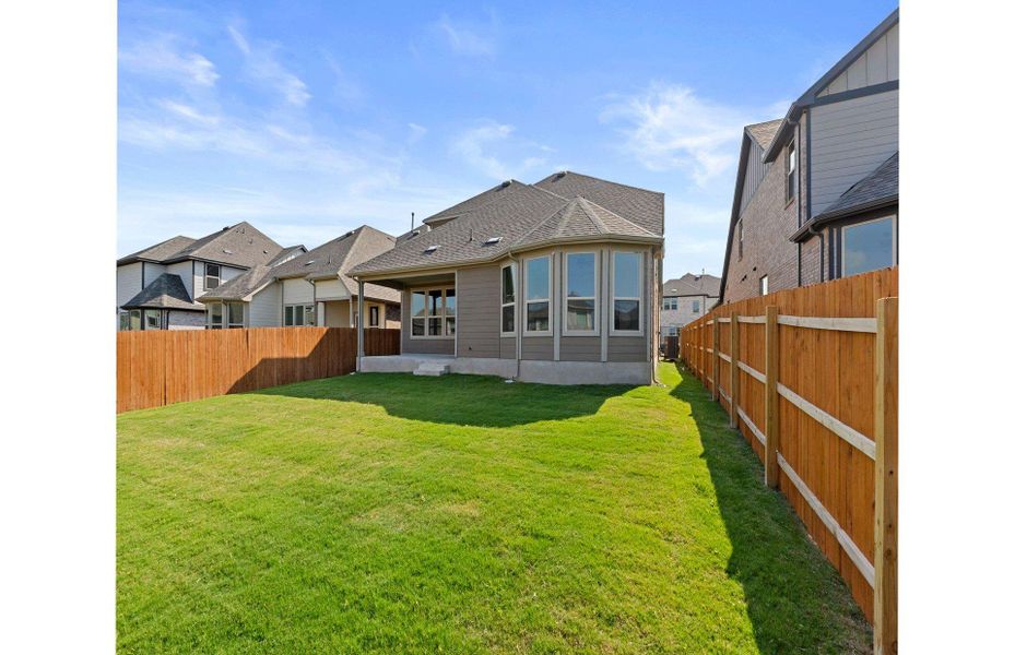 Exterior details and patio area of a home in Saddleback at Santa Rita Ranch, Liberty Hill (Image 8).
