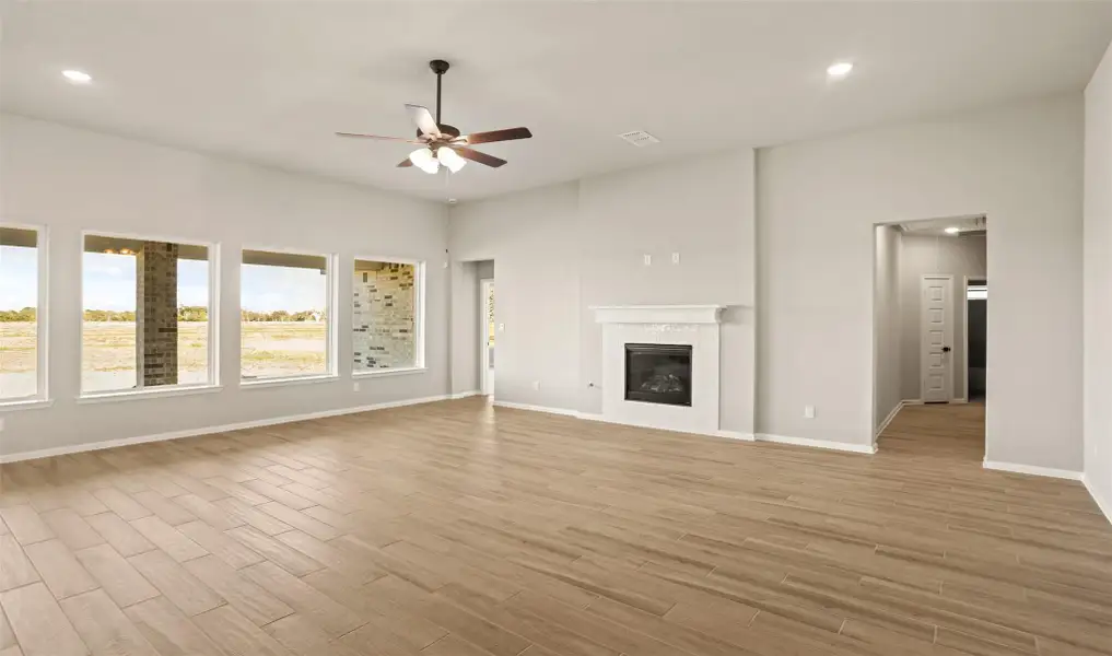 Impressive great room with cozy fireplace (*Photo not of actual home and used for illustration purposes only.)