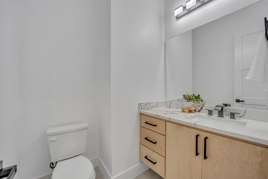 Bathroom with vanity and toilet