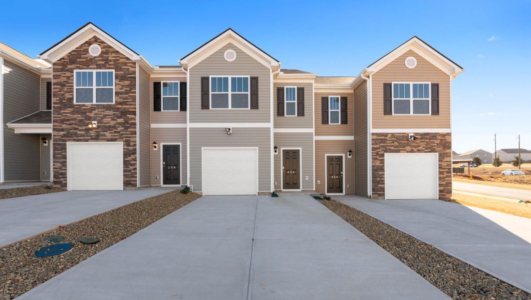 Front exterior of a new home in Tanglewood Townes, Greenville, SC, highlighting curb appeal (Image 1).