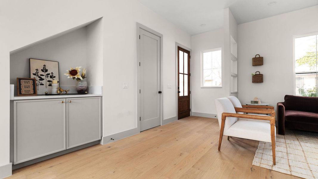 Entrance foyer featuring light wood-type flooring and baseboards