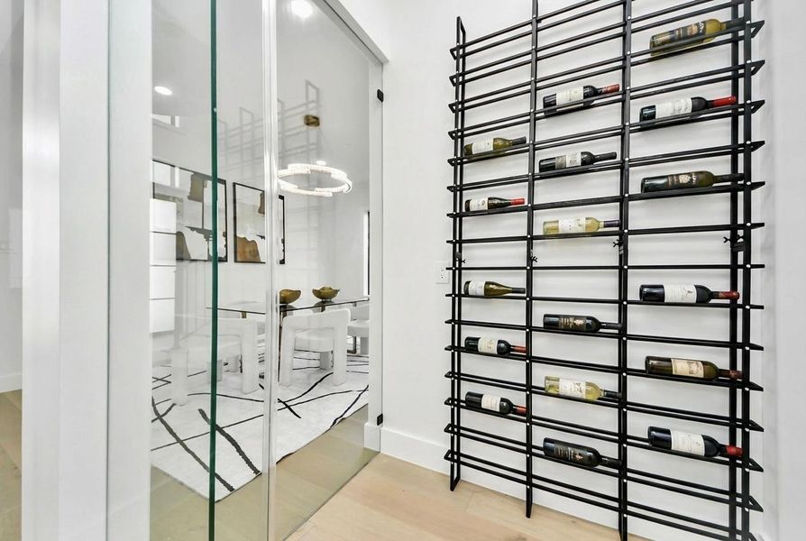 This wine cellar offers a refined space to store and showcase your collection, blending functionality with a touch of luxury for effortless entertaining.
