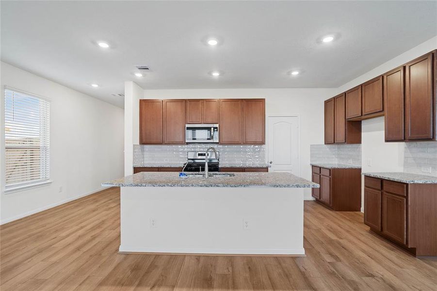 Another view of this beautiful and spacious kitchen!