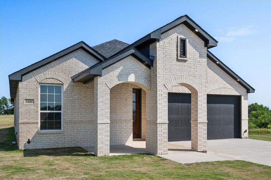 Front exterior of a new home in , Corsicana, TX, highlighting curb appeal (Image 20).