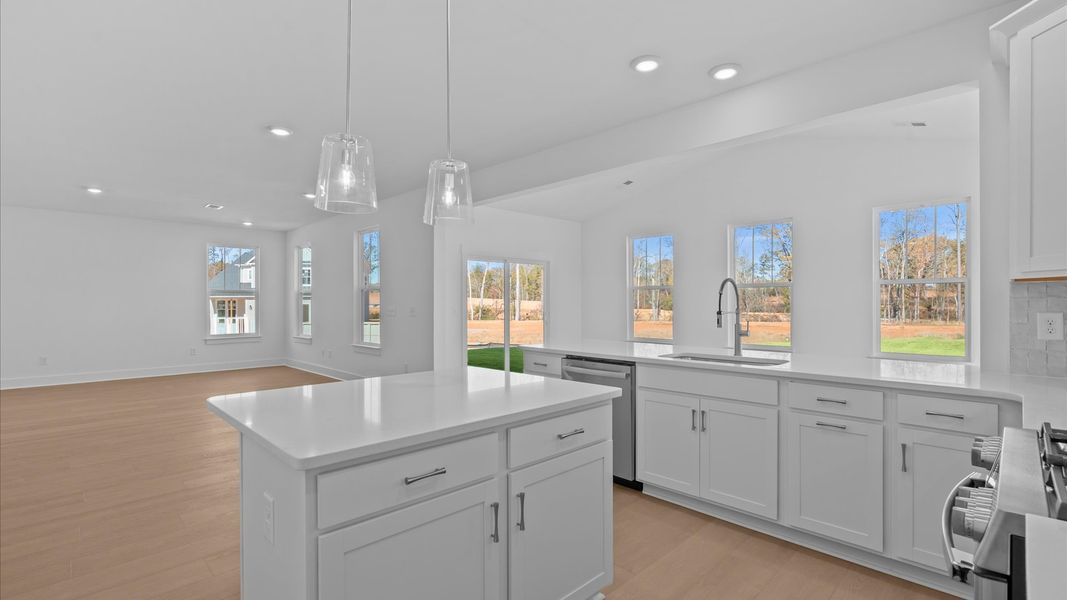 Highly functional kitchen offering a refined look and practical island at the center