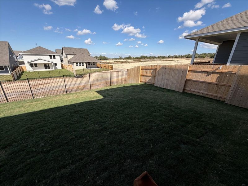 Exterior details and patio area of a home in Cannon Ranch 40s, Dripping Springs (Image 3).