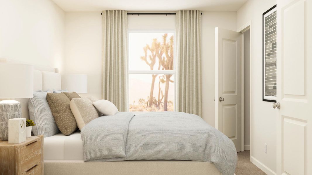 A bed with a white bed spread.