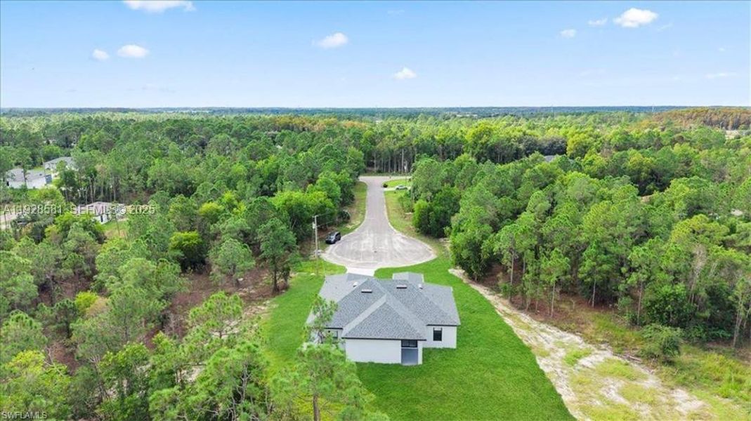 Front exterior of a new home in , Lehigh Acres, FL, highlighting curb appeal (Image 22).