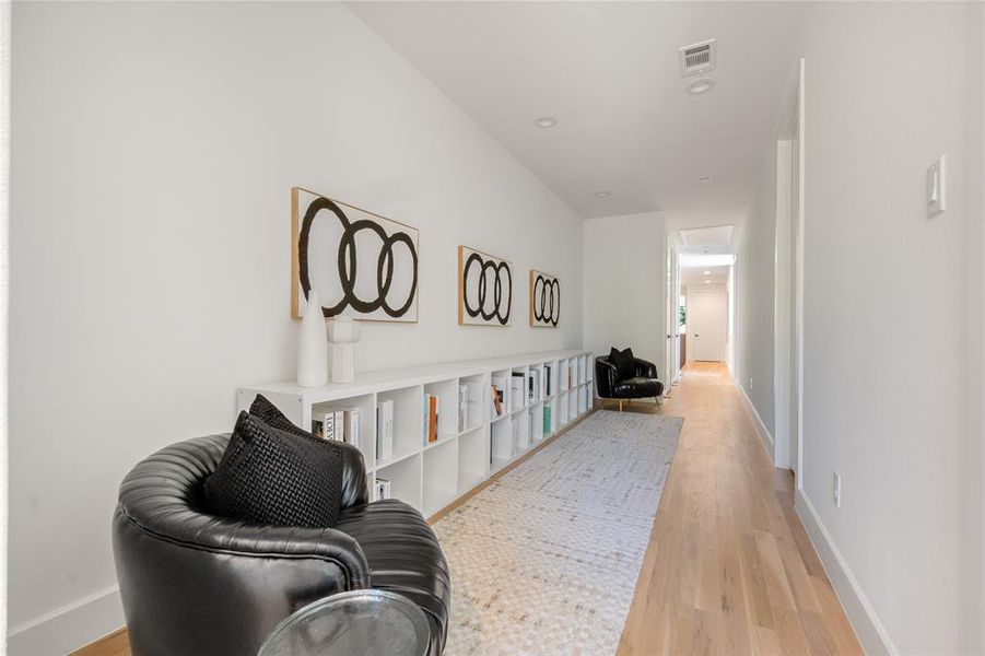 Living area with light hardwood / wood-style flooring