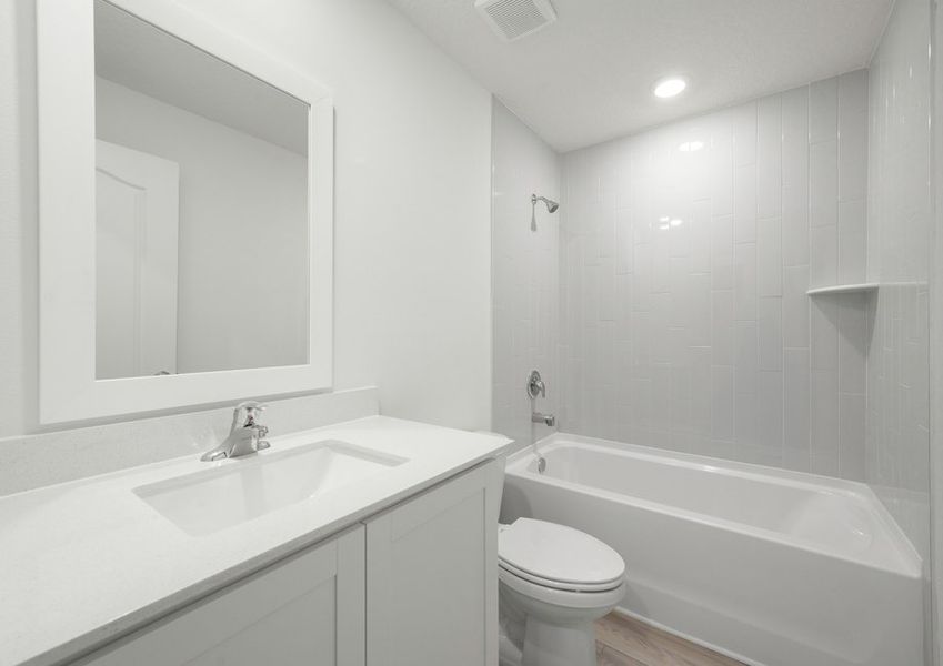 The spare bathroom has a large vanity ready for you guests to get ready at