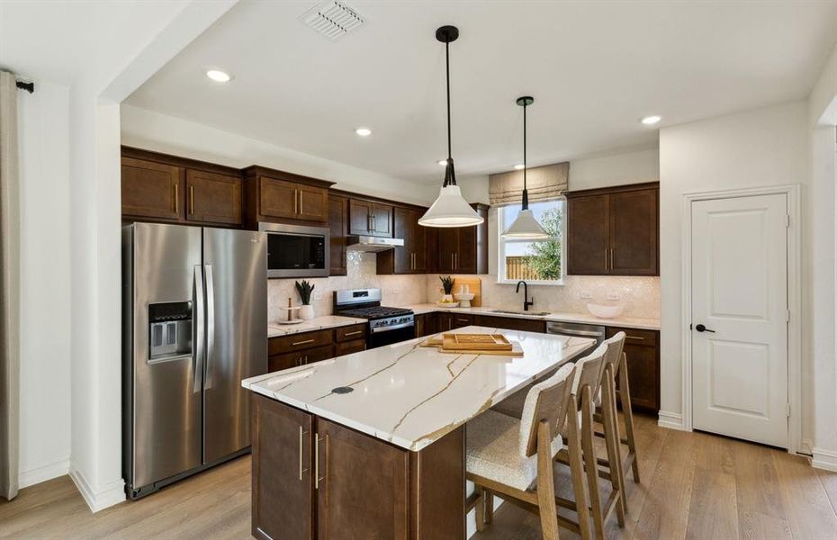 High-end gourmet kitchen with premium finishes and upgraded appliances *Model representation High-end gourmet kitchen with premium finishes and upgraded appliances *Model representation