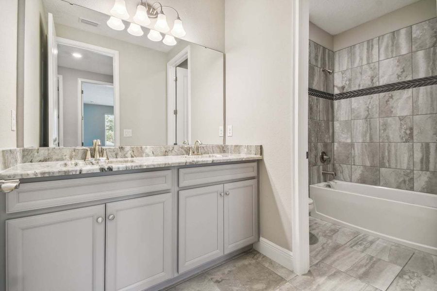 Representative furnished interior of a home built from the Sawgrass by William Ryan Homes in The Sanctuary – Royal Collection, Punta Gorda (Image 21).