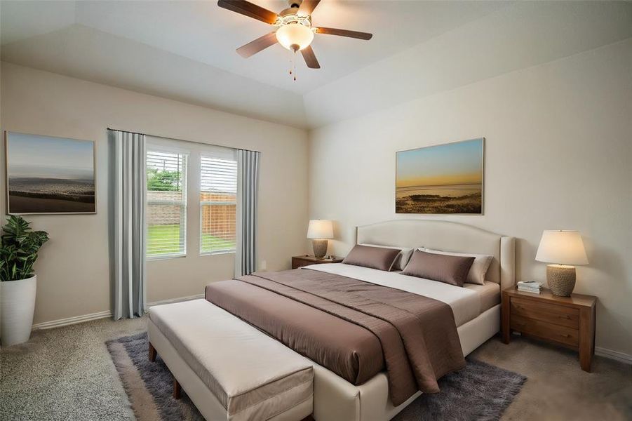 Bedroom featuring vaulted ceiling, light colored carpet, and ceiling fan