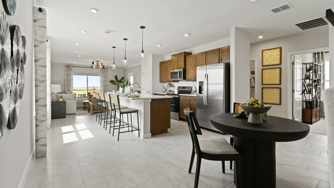 The Atlantic Model by DRB Homes Kitchen and Breakfast Nook with a large kitchen Island and premium finishes. The Atlantic Model by DRB Homes Kitchen and Breakfast Nook with a large kitchen Island and premium finishes.