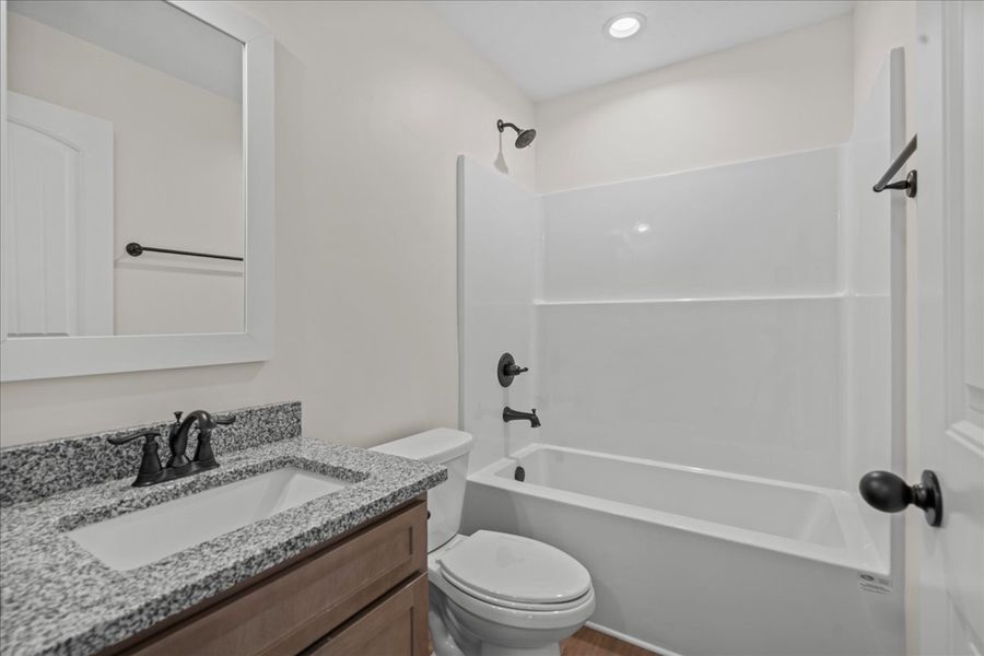 Representative furnished interior of a home built from the Cheshire by Enchanted Homes in Hampshire Heights, Moore (Image 10).